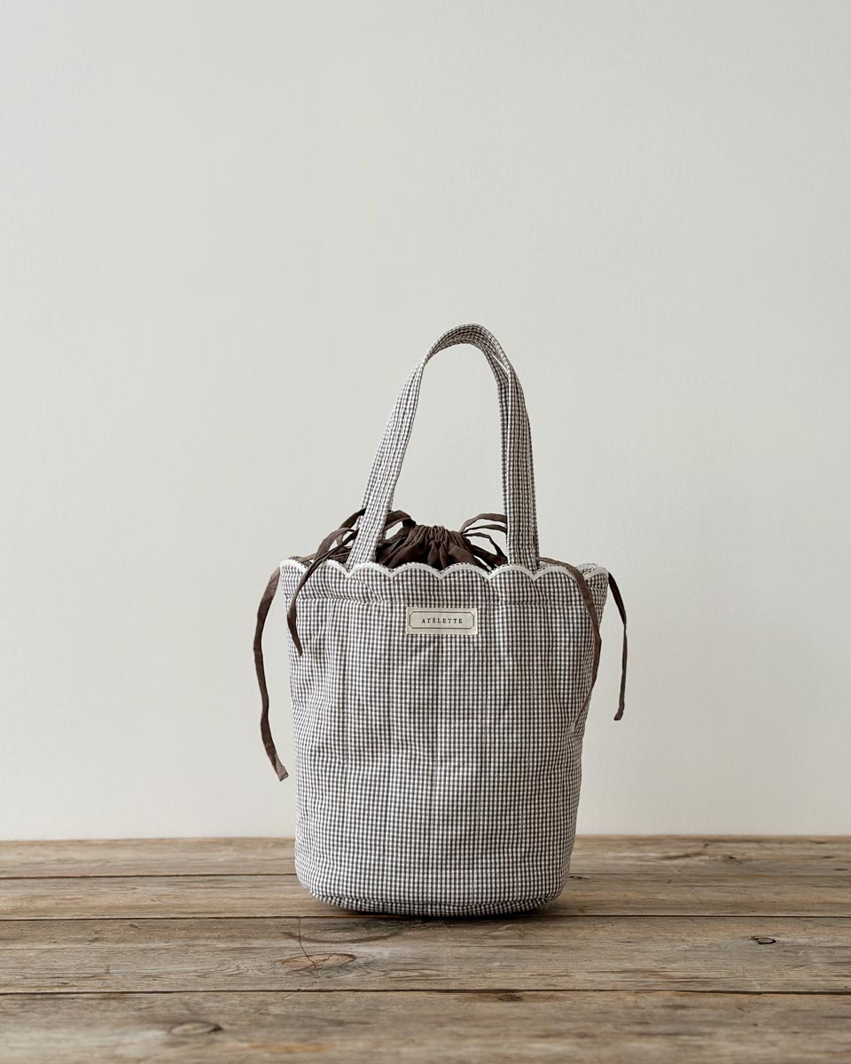 Dalaga Bag — quilted cotton gingham tote with scalloped edge and drawstring lining, ethically made in India.