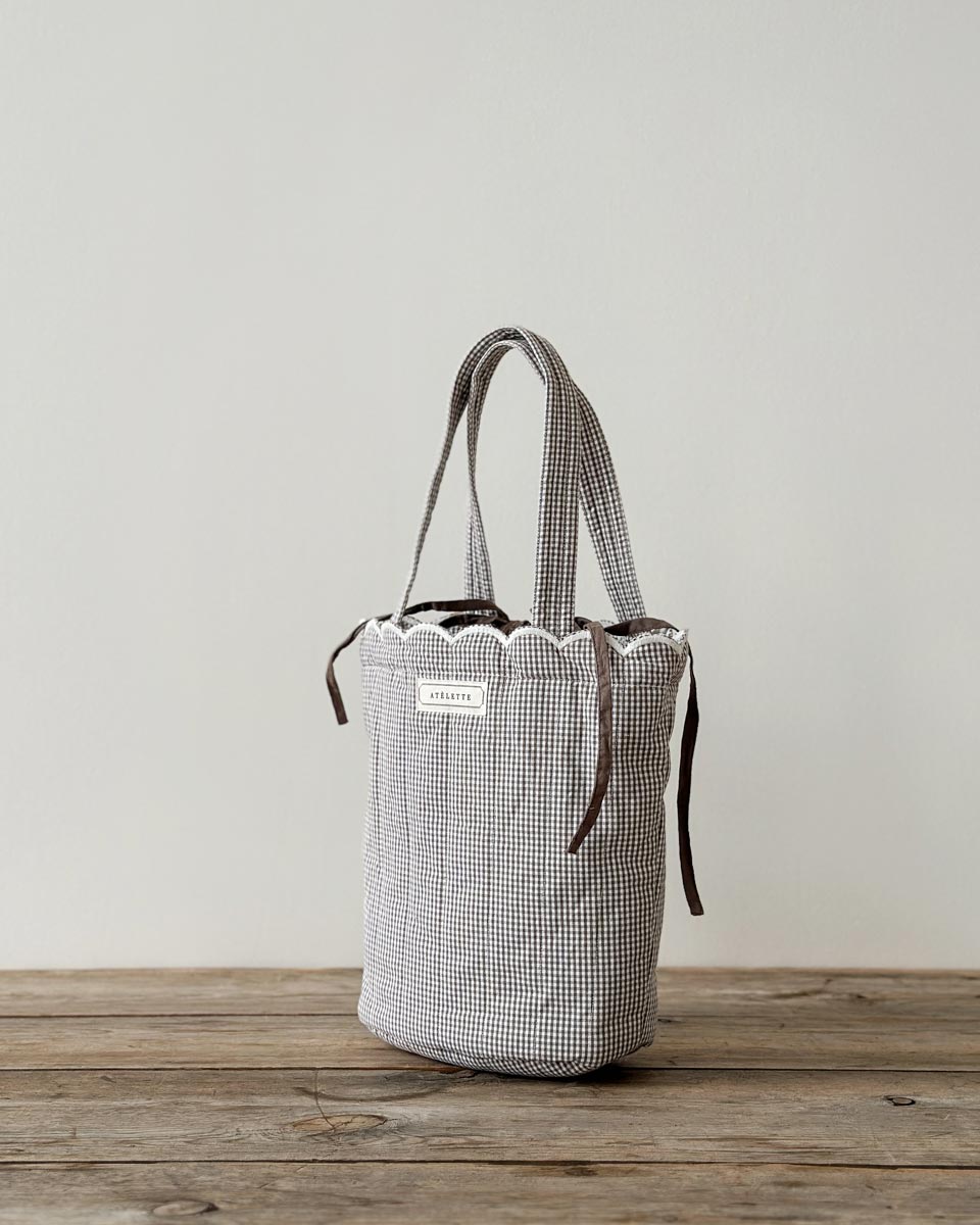 Dalaga Bag — quilted cotton gingham tote with scalloped edge and drawstring lining, ethically made in India.