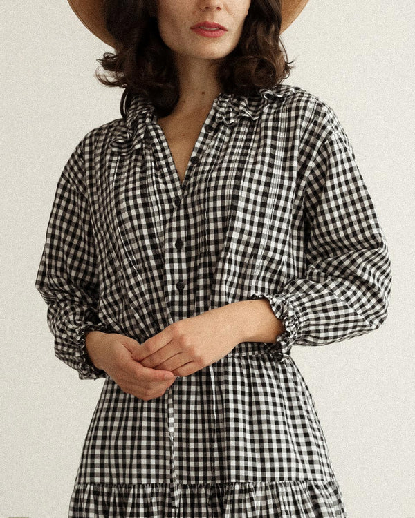 Nesaea Top in Prairie Noir — vintage-inspired black and white gingham blouse with ruffles and puff sleeves.