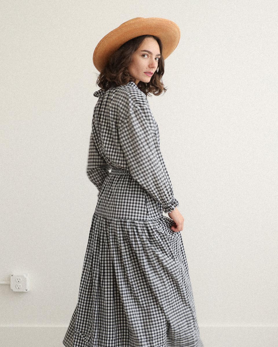 Nesaea Top in Prairie Noir — vintage-inspired black and white gingham blouse with ruffles and puff sleeves.