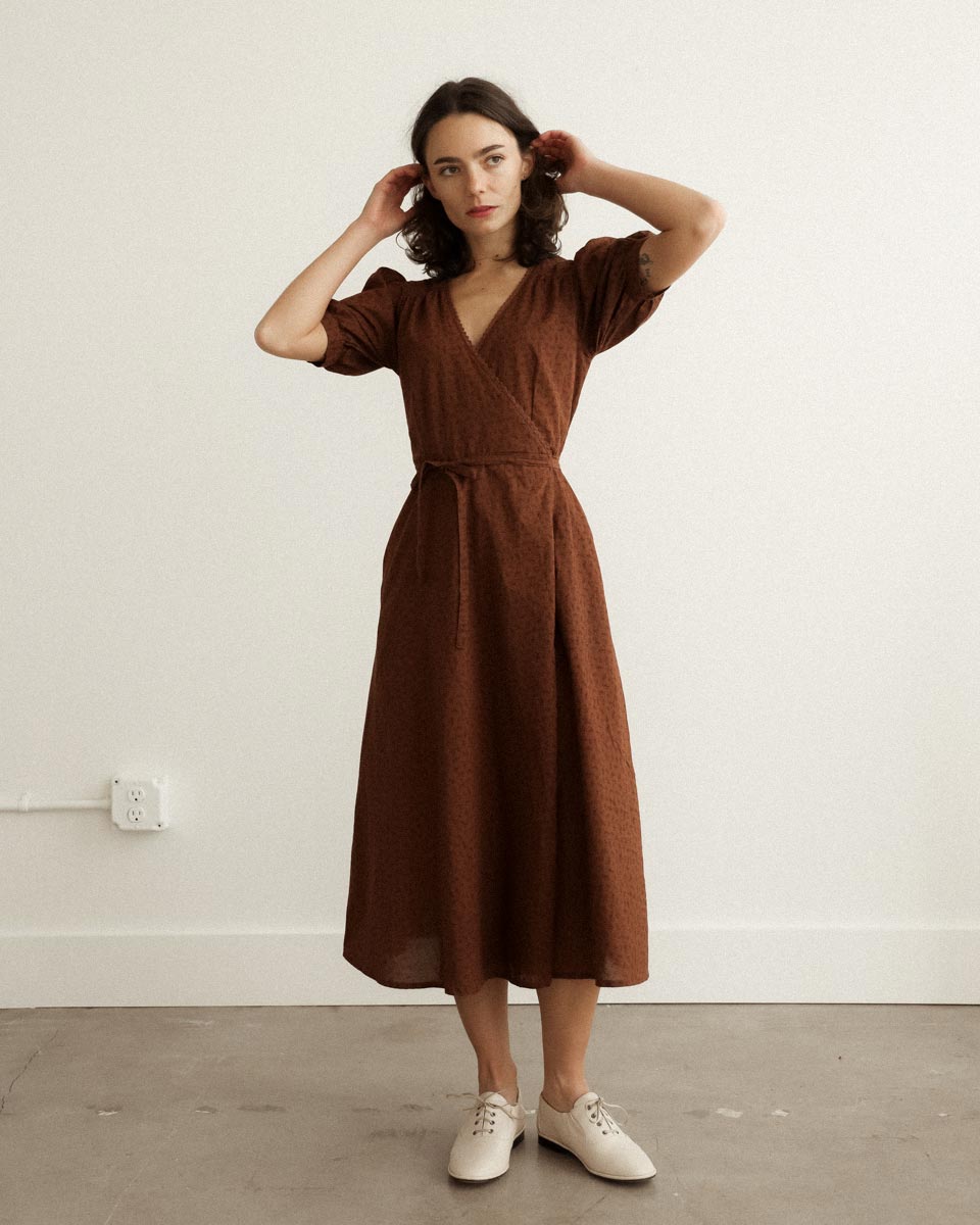 Pemberley Dress in Terre — vintage-inspired cocoa brown cotton wrap midi with lace trim and puff sleeves.
