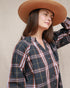 Closer view of Amelia Blouse in Colchester Plaid with relaxed raglan sleeves and curved hem