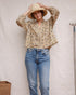 Amelia Terrasse floral cotton blouse with ruffled neckline and long gathered sleeves