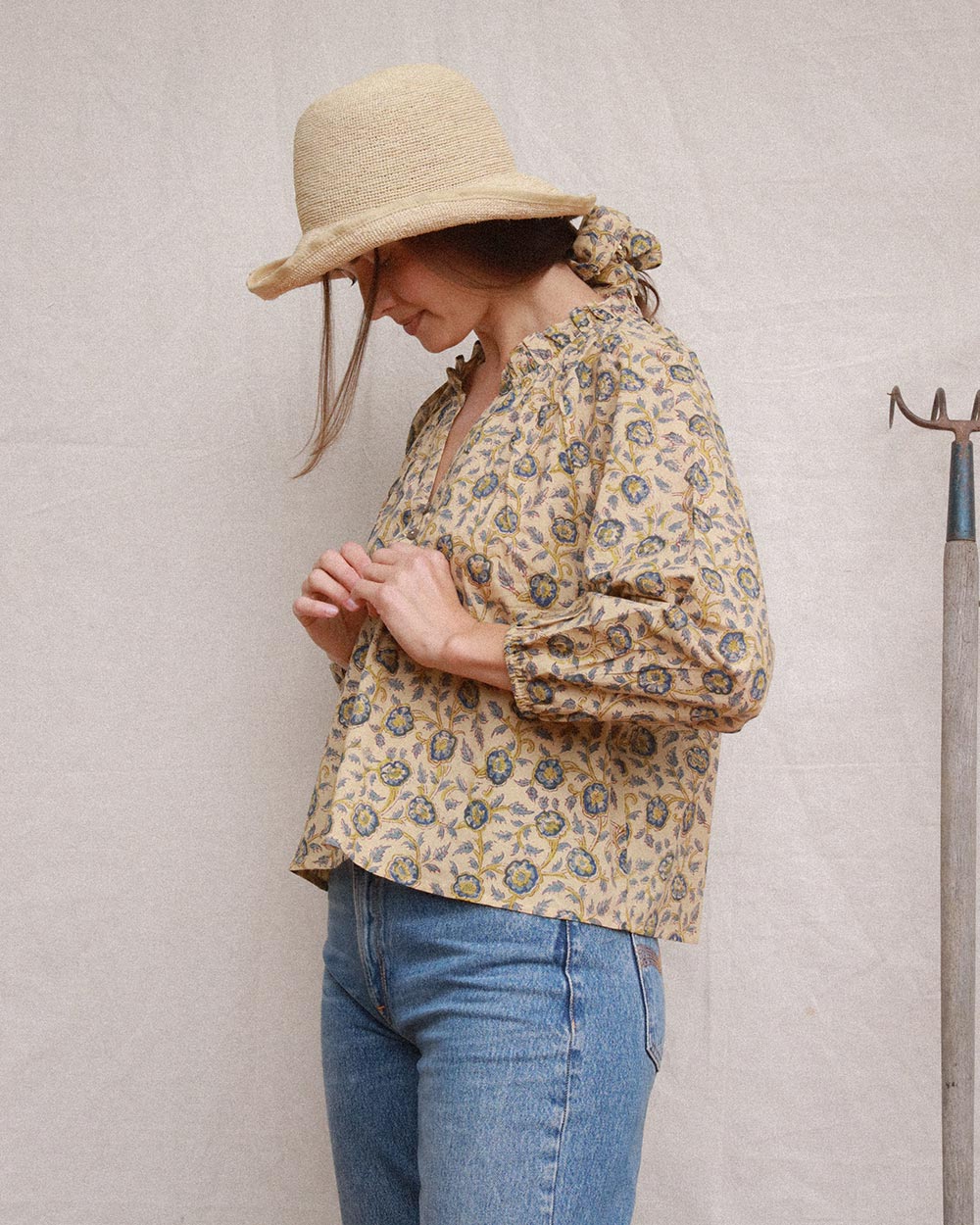 Amelia Terrasse floral cotton blouse with ruffled neckline and long gathered sleeves