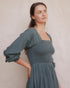 Detail of Louise Dress in Isle with square neckline, lace ruffle and smocked cotton bodice