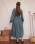 Back view of Louise Dress in Isle with smocked bodice and full gathered cotton gauze skirt