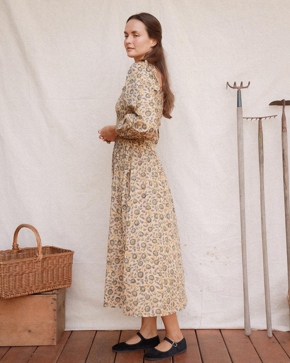Side view of Louise Dress in Terrasse with long puff sleeves and gathered midi skirt