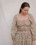Detail of Louise Dress in Terrasse with smocked cotton bodice and ruffled square neckline
