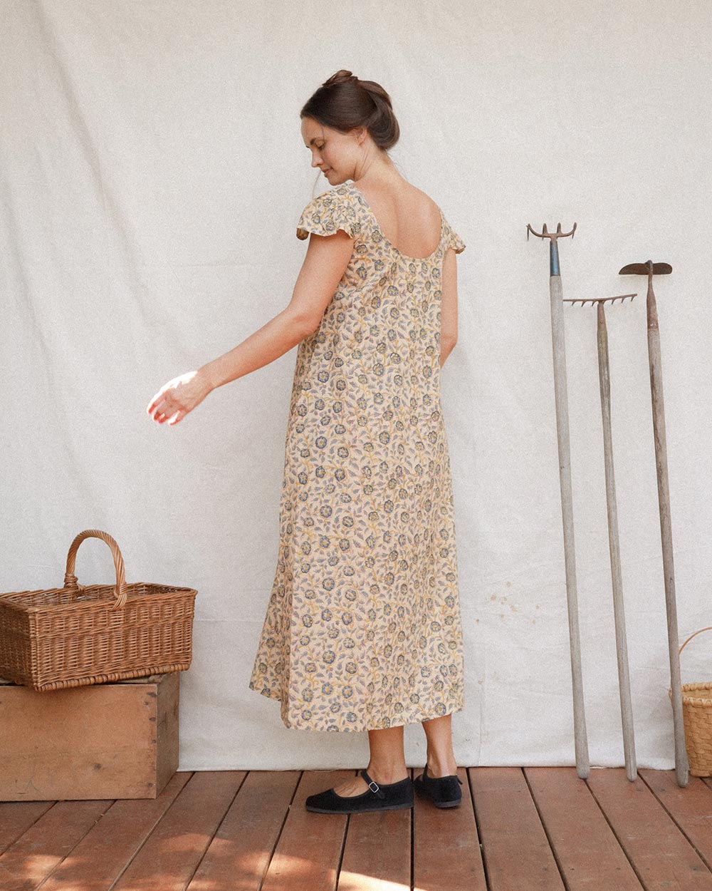 Back view of Lia Dress in Terrasse with relaxed A-line silhouette and flutter sleeves