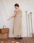 Back view of Lia Dress in Terrasse with relaxed A-line silhouette and flutter sleeves