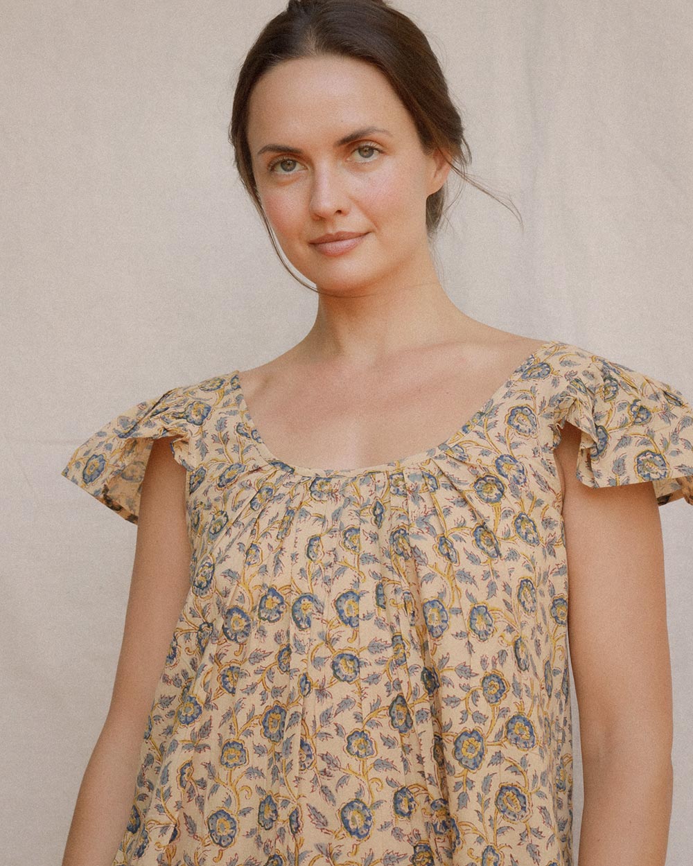 Detail of Lia Dress in Terrasse hand block floral cotton with gathered scoop neckline